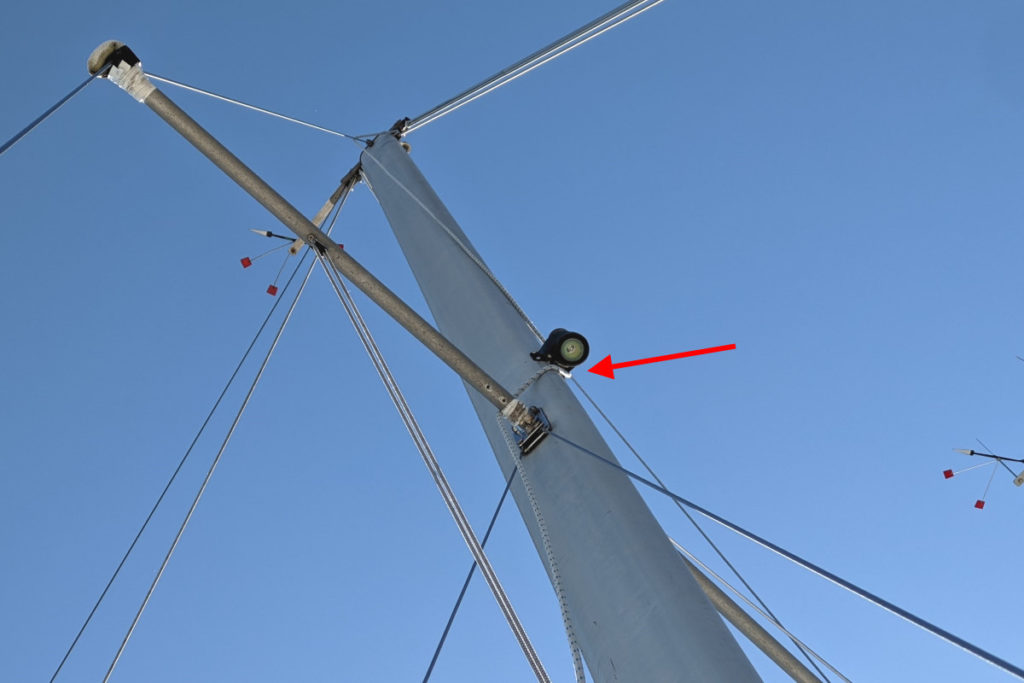 Photo pointing out the line wrapped around the deck light on the front of the mast