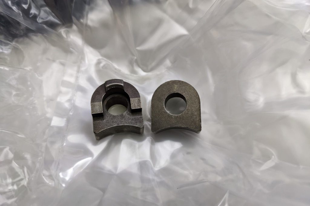 Two bronze clip things