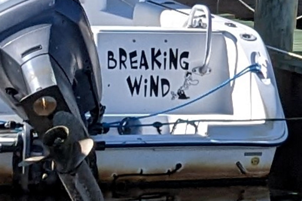 Zoom in on the boat's name, Breaking Wind