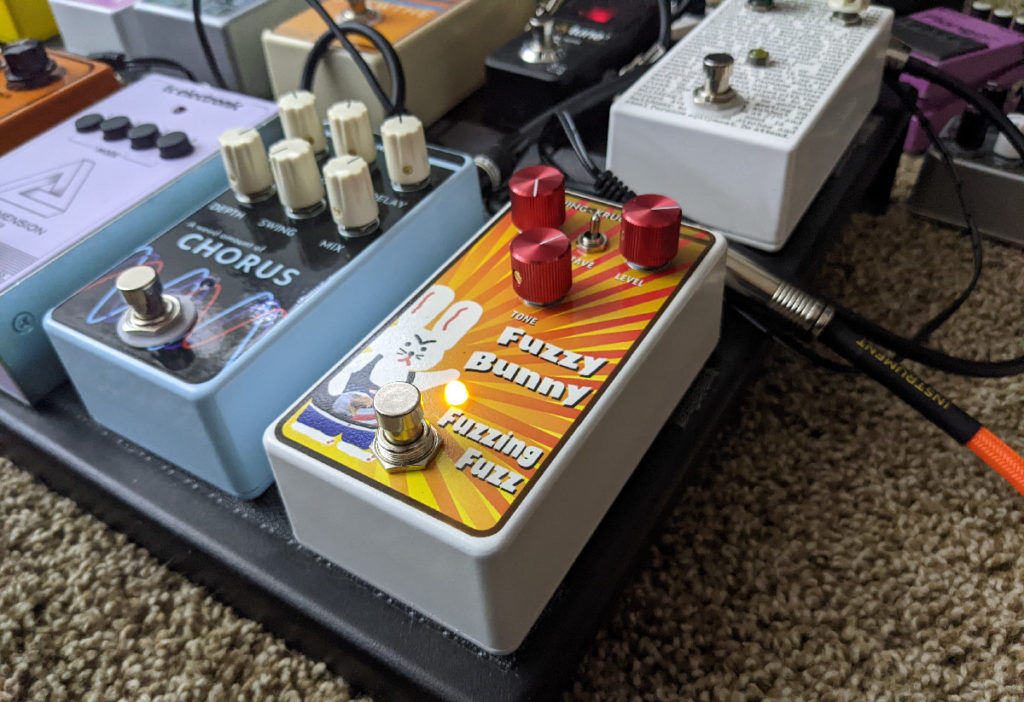 The Fuzzy Bunny Fuzzing Fuzz guitar pedal and assorted hoopla